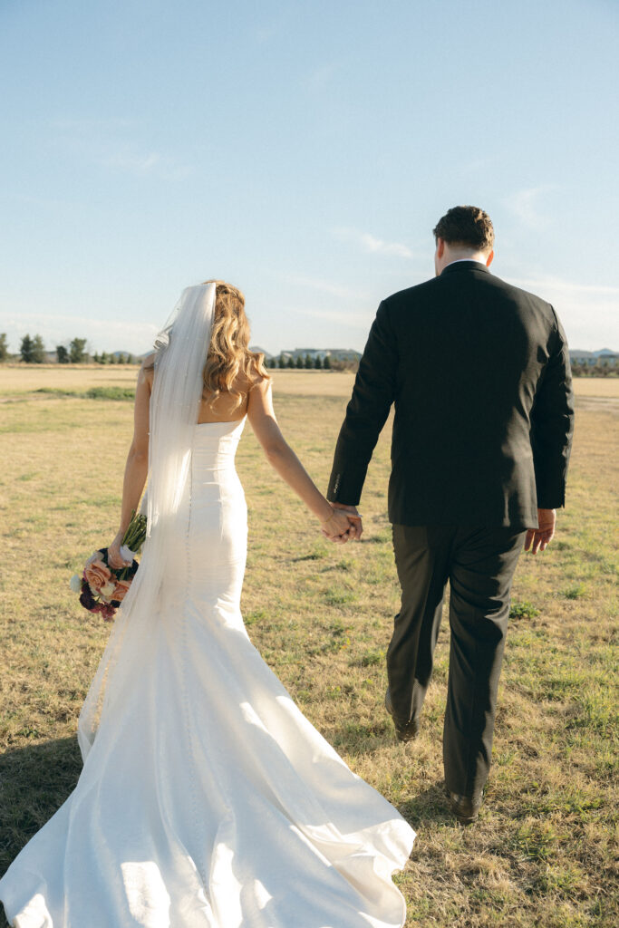 Romantic sunset wedding portraits at Schnepf Farms Big Red Barn in Arizona