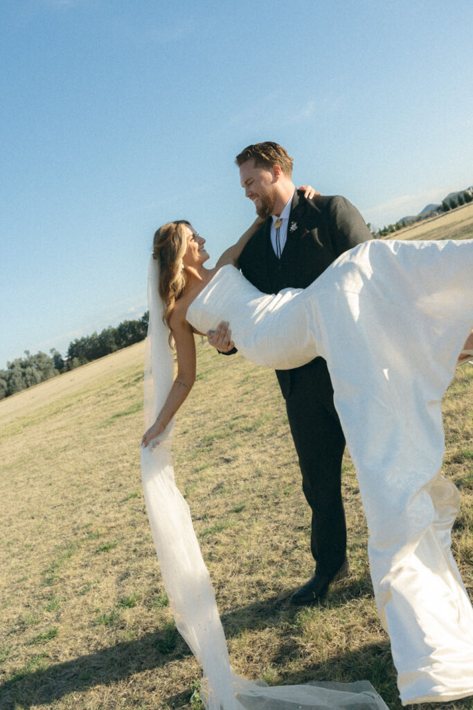 Romantic sunset wedding portraits at Schnepf Farms Big Red Barn in Arizona