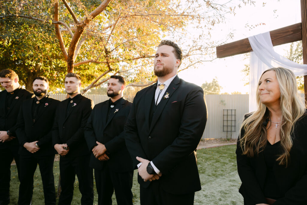 Outdoor wedding ceremony at Schnepf Farms Big Red Barn in Queen Creek Arizona during sunset