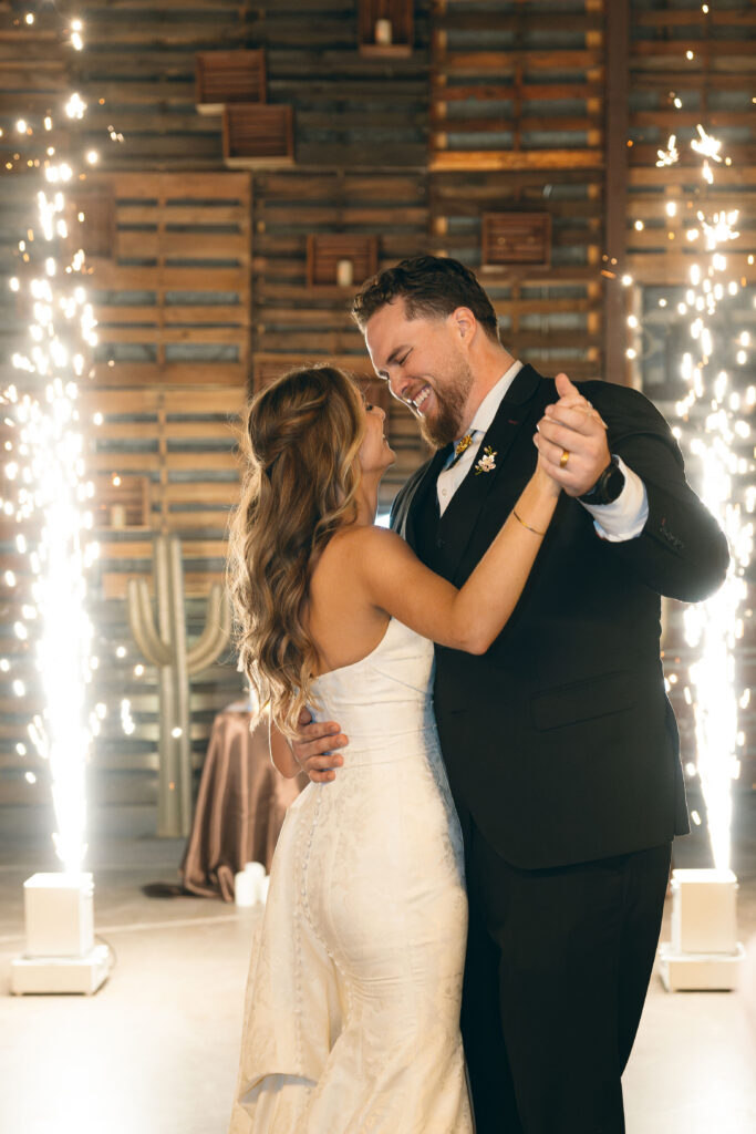 Bride and groom first dance at Big Red Barn wedding reception at Schnepf Farm with Cold Sparks