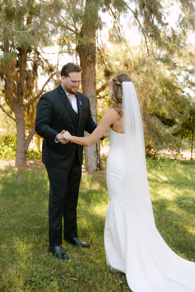 Bride and groom sharing private vows during first look at Schnepf Farms Big Red Barn in Queen Creek Arizona