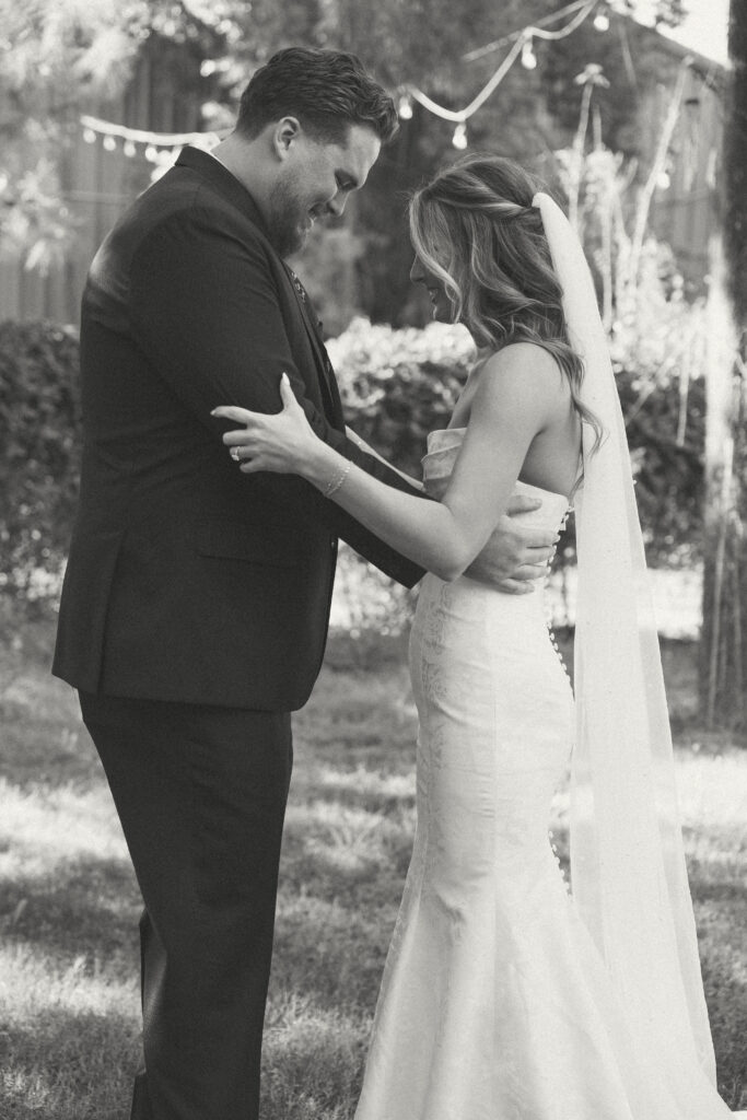 Bride and groom sharing private vows during first look at Schnepf Farms Big Red Barn in Queen Creek Arizona
