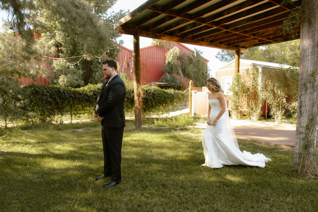 Bride and groom sharing private vows during first look at Schnepf Farms Big Red Barn in Queen Creek Arizona
