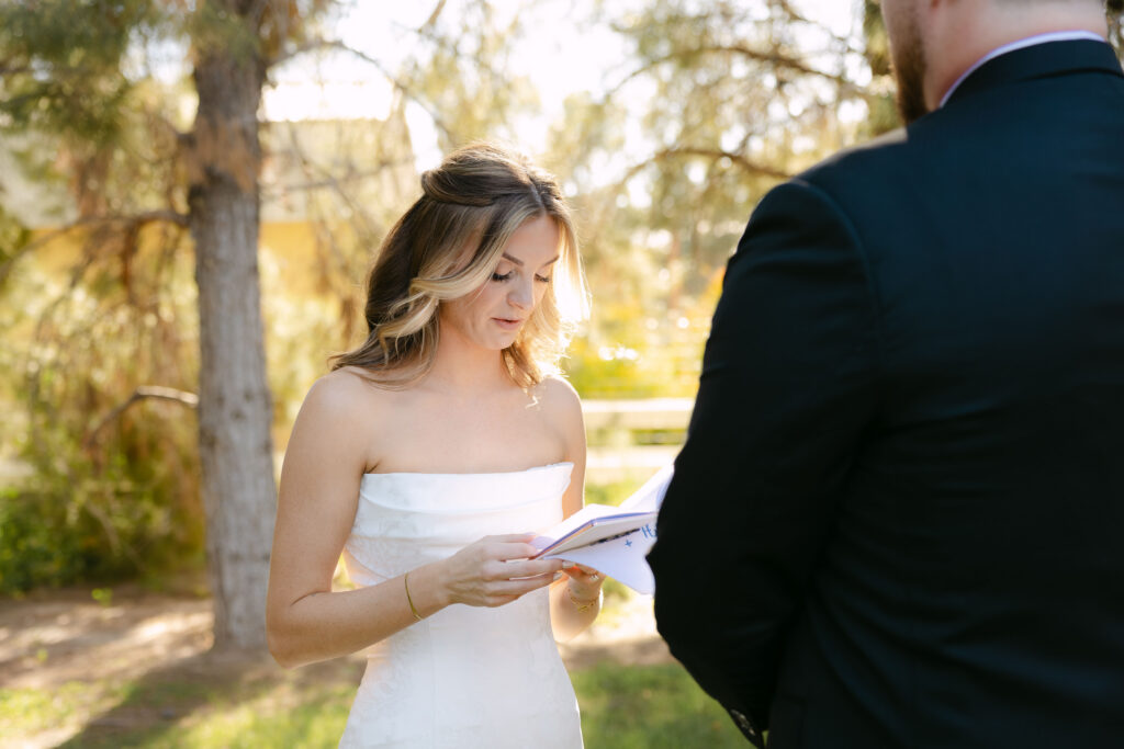 Bride and groom sharing private vows during first look at Schnepf Farms Big Red Barn in Queen Creek Arizona
