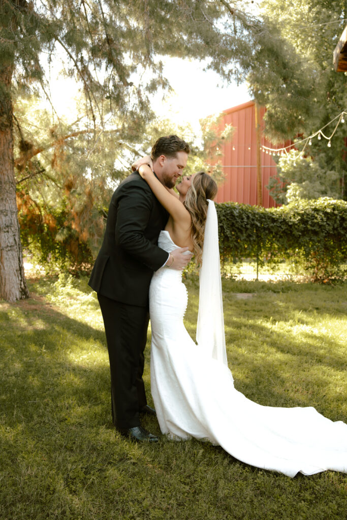 Bride and groom sharing private vows during first look at Schnepf Farms Big Red Barn in Queen Creek Arizona
