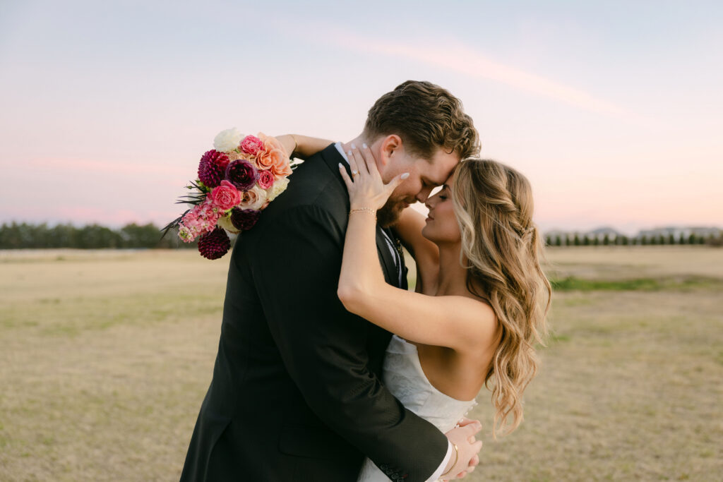 Bride and groom wedding portraits at Schnepf Farms Big Red Barn in Arizona