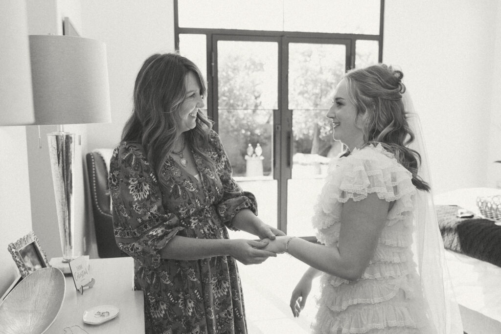 Bride getting ready with her mother before an intimate backyard wedding in Arizona.